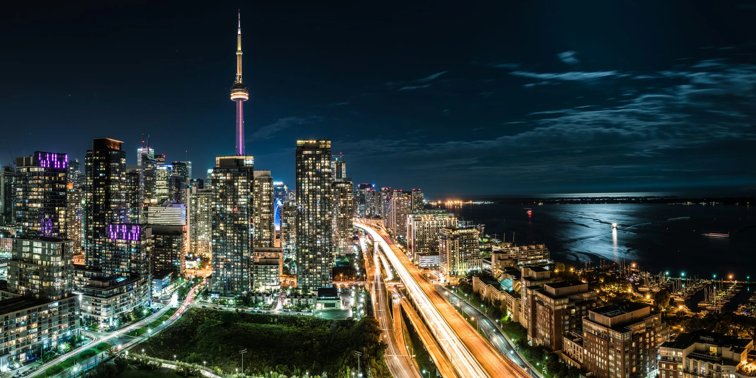 The Toronto skyline at night with the CN Tower and waterfront
